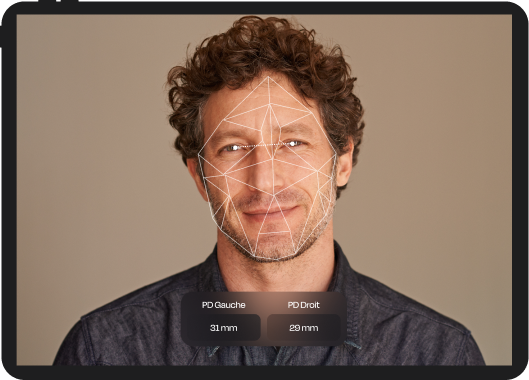 Man’s face with geometric facial mapping overlay, showing measured pupillary distance for left and right eyes in millimeters